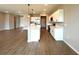 Open-concept kitchen with a central island, white cabinets, and modern appliances at 2647 Sw 154Th Ln, Ocala, FL 34473