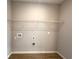 Functional laundry room with tile flooring, shelving for storage, and connections for washer and dryer at 2647 Sw 154Th Ln, Ocala, FL 34473