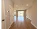 Spacious living room boasts wood-look tile flooring, recessed lighting, and sliding glass doors to the backyard at 2647 Sw 154Th Ln, Ocala, FL 34473