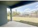 A view of the large fenced backyard and lawn from the covered back patio at 3015 Sw 132Nd St, Ocala, FL 34473