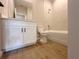 Bathroom with a white vanity, mirror, toilet, and tub/shower combination at 3015 Sw 132Nd St, Ocala, FL 34473