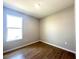Bedroom featuring wood-look flooring and a window providing natural light at 3015 Sw 132Nd St, Ocala, FL 34473