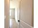 Bright hallway with tiled floors and view into a bedroom at 3015 Sw 132Nd St, Ocala, FL 34473