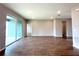 Open-concept living room with access to the lanai, neutral walls, and tile flooring at 3015 Sw 132Nd St, Ocala, FL 34473