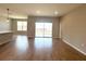Bright living space featuring tile floors and sliding glass doors that lead to the outdoor space at 3015 Sw 132Nd St, Ocala, FL 34473