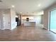 Open floor plan showcasing living, dining, and kitchen area with modern finishes at 3015 Sw 132Nd St, Ocala, FL 34473