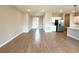 Expansive living space featuring wood-look tile flooring and an open concept design into the kitchen at 3015 Sw 132Nd St, Ocala, FL 34473