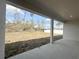 Covered back porch provides outdoor views of the landscaped backyard, perfect for relaxing at 3547 Sw 130Th Lane Rd, Ocala, FL 34473