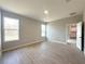 Bright bedroom with tile flooring and two windows offering natural light at 3547 Sw 130Th Lane Rd, Ocala, FL 34473