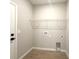 Functional laundry room with tile floor, shelving, and utility connections at 3547 Sw 130Th Lane Rd, Ocala, FL 34473