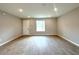 Bright, airy living room with wood-look tile flooring and recessed lighting at 3547 Sw 130Th Lane Rd, Ocala, FL 34473