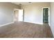 Main bedroom featuring wood-look tile flooring and an ensuite bathroom entrance at 3547 Sw 130Th Lane Rd, Ocala, FL 34473
