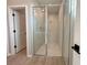 Modern bathroom featuring a glass shower with sleek fixtures and neutral tile at 3547 Sw 130Th Lane Rd, Ocala, FL 34473
