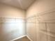 The image shows a well-organized walk-in closet with adjustable shelving for ample storage at 3547 Sw 130Th Lane Rd, Ocala, FL 34473