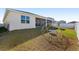 Backyard with covered patio and play structure at 6200 Sw 72Nd Ter, Ocala, FL 34474
