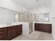 Elegant bathroom with double vanity, large shower and bright lighting at 6200 Sw 72Nd Ter, Ocala, FL 34474