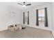 Bright bedroom with large windows, ceiling fan and carpeted floor at 6200 Sw 72Nd Ter, Ocala, FL 34474