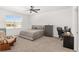 Cozy bedroom with carpeted floor, built-in dresser and a rocking chair at 6200 Sw 72Nd Ter, Ocala, FL 34474