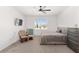 Bedroom with large bed, dresser, rocker, and TV at 6200 Sw 72Nd Ter, Ocala, FL 34474