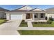 Two-story home with attached garage and front porch at 6200 Sw 72Nd Ter, Ocala, FL 34474