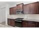 Kitchen with stainless steel appliances and granite countertops at 6200 Sw 72Nd Ter, Ocala, FL 34474