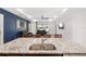 Kitchen island with granite countertops and double sink overlooking the living room at 6200 Sw 72Nd Ter, Ocala, FL 34474
