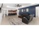 Spacious living room with leather furniture, ceiling fan, and view of kitchen at 6200 Sw 72Nd Ter, Ocala, FL 34474