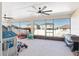 Spacious screened porch with ceiling fans and toys at 6200 Sw 72Nd Ter, Ocala, FL 34474