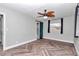 Bedroom featuring herringbone floors and a barn door at 812 Se 23Rd St, Ocala, FL 34471