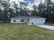 Newly constructed one-story home with a two-car garage and well-manicured lawn at 9880 Sw 189Th Cir, Dunnellon, FL 34432