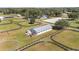 Aerial view of equestrian estate with barn and paddocks at 10555 W Highway 40, Ocala, FL 34482