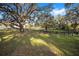 Pasture with large oak trees and wooden fence at 10555 W Highway 40, Ocala, FL 34482