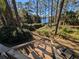 Scenic backyard showing wooded pathway leading to lake at 14830 Se 61St Street Rd, Ocklawaha, FL 32179