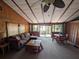Inviting living room with vaulted ceiling, comfortable seating, and sliding glass doors at 14830 Se 61St Street Rd, Ocklawaha, FL 32179