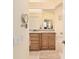 Bathroom view with a bathtub, granite countertops, and wood cabinets at 19009 Sw 98Th Loop, Dunnellon, FL 34432