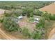 Aerial view of property with a mobile home and several outbuildings at 21500 Sw 33Rd St, Dunnellon, FL 34431