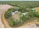 Aerial view of property with home and metal buildings at 21500 Sw 33Rd St, Dunnellon, FL 34431