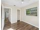 Cozy bedroom with convenient closet access and wood-look floors at 2605 Ne 14Th Ave, Ocala, FL 34470