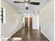 Large bedroom featuring wood-look flooring, ceiling fan and lots of natural light at 2605 Ne 14Th Ave, Ocala, FL 34470
