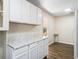 Bright kitchen with updated countertops, white cabinetry, and modern flooring at 2605 Ne 14Th Ave, Ocala, FL 34470