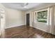 Spacious living room featuring new flooring, neutral walls, and a window at 2605 Ne 14Th Ave, Ocala, FL 34470