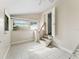 Bright sunroom with tiled floors, natural light and small staircase at 2605 Ne 14Th Ave, Ocala, FL 34470