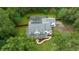 Aerial view of a two-story house with pool and lush landscaping at 2704 Se 31St St, Ocala, FL 34471