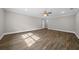 Large bedroom with wood-look floors and ceiling fan at 2704 Se 31St St, Ocala, FL 34471