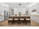 Modern kitchen with large island, pendant lighting, and white cabinetry at 2704 Se 31St St, Ocala, FL 34471