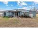 Backyard with covered patio and some plants at 35 Teak Rd, Ocala, FL 34472