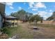 Large backyard with gazebo, fruit trees, and open space at 35 Teak Rd, Ocala, FL 34472