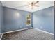 Bedroom with gray walls and carpeted floor at 35 Teak Rd, Ocala, FL 34472