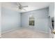 Bright bedroom with ceiling fan and window at 35 Teak Rd, Ocala, FL 34472