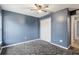 Simple bedroom with ceiling fan and neutral walls at 35 Teak Rd, Ocala, FL 34472